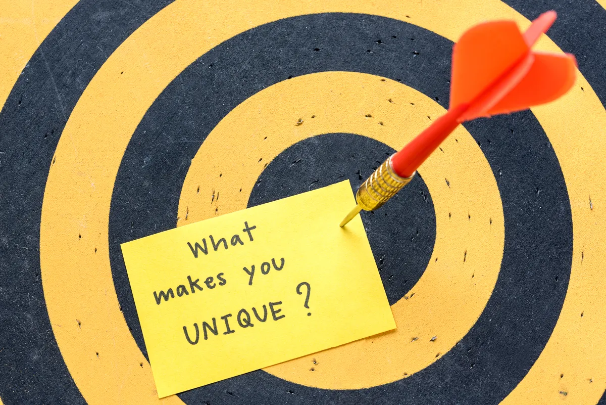 massage what makes you unique over dartboard background